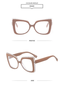 Macro shot of khaki oversized cat-eye glasses frame with dual-layer design detail