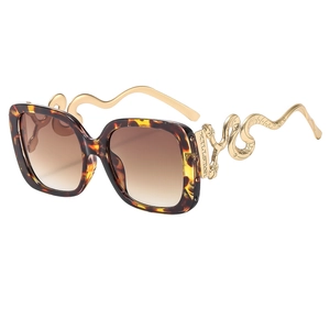 Oversized square tortoise sunglasses with gold snake-shaped metal temples and gradient lenses