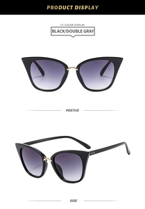Cat eye sunglasses detail with black frame, purple gradient lenses and gold metal accents