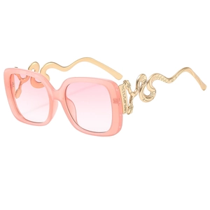 Pink oversized sunglasses with golden snake-shaped metal temples and gradient lenses