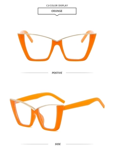 Close-up of stylish orange cat-eye eyeglass frames with elegant gold metal top accents