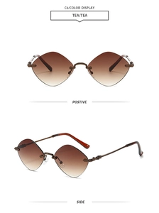 Detail of rimless diamond-cut tea gradient lenses with engraved bronze metal temples
