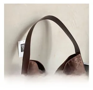 Close-up of comfortable wide shoulder strap and soft leopard print tote bag material