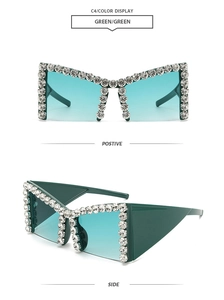Detail of green oversized sunglasses featuring crystal-studded frames and gradient lenses