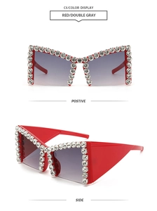 Detail of red oversized sunglasses featuring crystal rhinestones and grey gradient lenses