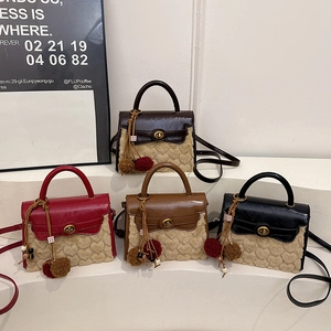 Lambswool and leather patchwork Kelly bag with heart texture and plush tassel charms