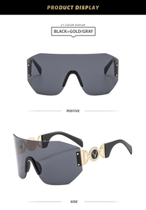 Détails de lunettes de soleil sans monture avec logo élan doré sur les branches noires et or