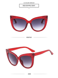 Macro detail of red glitter cat-eye sunglasses with double gray gradient lenses