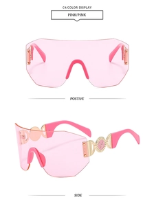 Gros plan de lunettes de soleil roses sans monture montrant le logo cerf doré sur la branche