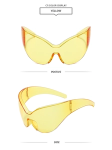 Lunettes de soleil œil-de-chat jaunes futuristes avec design sans monture et vues latérales