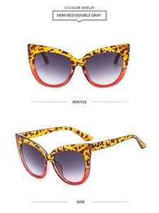 Detail view of cat eye sunglasses in demi red and double gray with tortoiseshell frames
