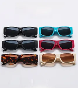 Close-up of retro rectangular sunglasses in multiple colors with wide frames and UV protection