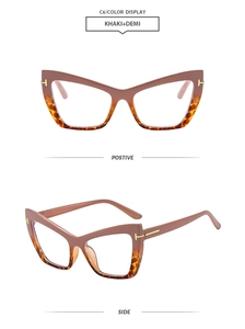 Detail of cat-eye glasses frame featuring khaki and demi contrast with gold T-shaped metal hinges