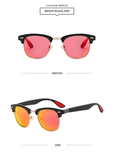 Macro detail of retro Clubmaster sunglasses with black frames and red mirrored lenses