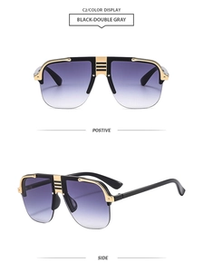 Detail view of large pilot sunglasses with black-gold frame and gradient purple lenses