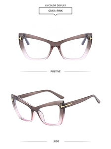 Detail view of cat eye glasses with grey-pink gradient frame and golden T-shaped hinge