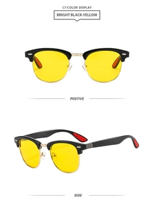 Classic browline sunglasses featuring bright black frames and high contrast yellow lenses