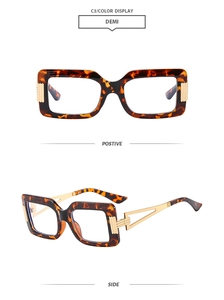 Detail of tortoise shell square frames with hollowed gold metal temples and hinges