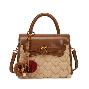 Brown leather and beige faux fur handbag with heart texture and plush charm