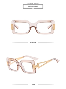 Detail of square champagne frame glasses with golden hollow geometric temples