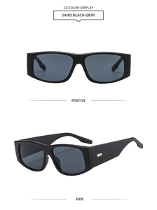 Detail of matte sand black sunglasses frame with square metal studs and gray lenses