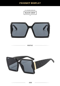 Detail view of square black sunglasses with rivet accents and quilted texture on temples