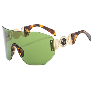 Lunettes de soleil de sport sans monture vertes avec branches en écaille et logo