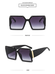 Detail view of square black sunglasses with quilted temples and golden metal accents