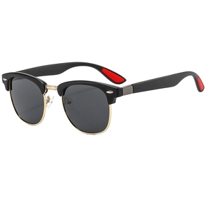 Classic retro round frame sunglasses with black and gold browline design and gray lenses