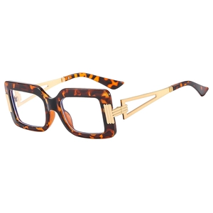 Modern square tortoiseshell glasses with golden geometric cut-out metal temples