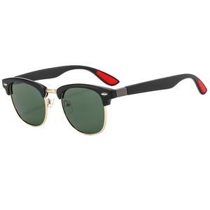Classic round oversized semi-rimless sunglasses in black and gold with green lenses