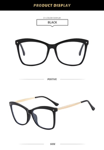 Detail view of black cat-eye glasses frame with silver rivets and gold metal temples