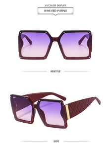 Detail of burgundy oversized sunglasses with diamond texture on the temples and gold accents