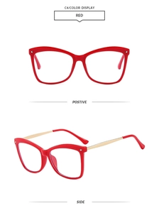 Detail view of red cat-eye glasses frame with golden metal temples and smooth finish
