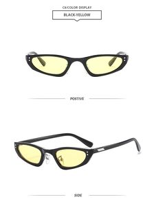 Détail de lunettes de soleil œil de chat vintage noires avec verres jaunes