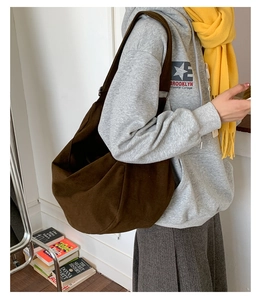 Detail of a large brown hobo bag with a soft matte texture for everyday commute