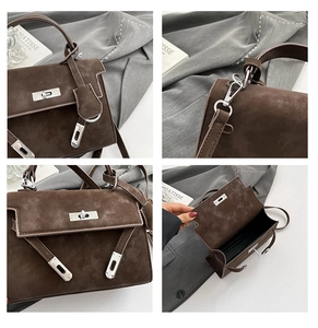 Detail view of dark brown suede Kelly bag featuring silver hardware and interior card slot
