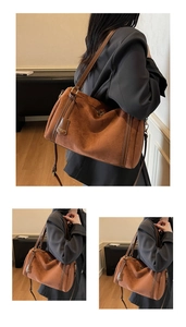Detail view of brown faux suede Boston bag with leather handles and zip closure
