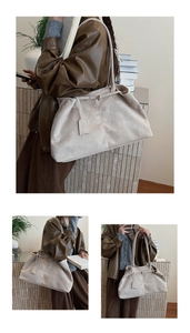 Detailed view of sand-colored suede tote bag with pleated design and thin shoulder straps