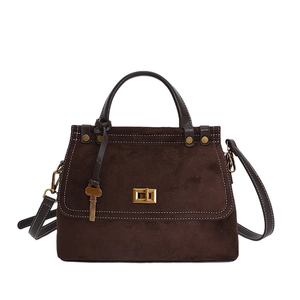 Sac à main vintage en daim marron foncé avec poignées en cuir et fermoir doré