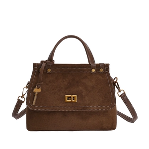 Retro dark brown suede messenger bag with white stitching and golden square lock