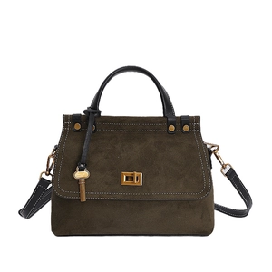 Detail of olive green suede Kelly bag showing contrast stitching and gold twist lock