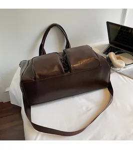 Macro shot of dark brown washed leather bag texture with metal zipper and front pocket