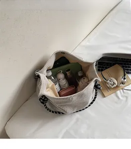 Large capacity beige corduroy tote bag showing spacious interior with daily essentials
