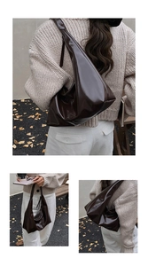 Detailed view of the dark brown glossy leather tote bag showing smooth patent finish