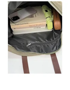 Internal view of dark green canvas tote bag with large capacity and zipper pocket