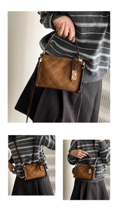 Detail of brown quilted crossbody bag with gold twist lock and adjustable shoulder strap