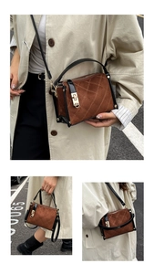Detailed view of brown quilted crossbody bag with black trim and golden metal clasp lock