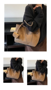 Macro detail of brown suede tote bag featuring leather drawstring and side coin purse