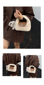 Detail of plush faux fur crossbody bag featuring brown leather flap and rabbit pendant
